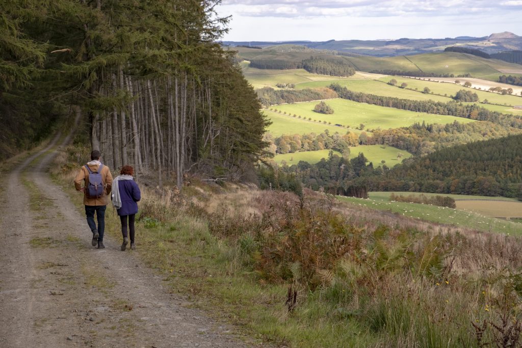 Two walkers in the Scottish Borders.